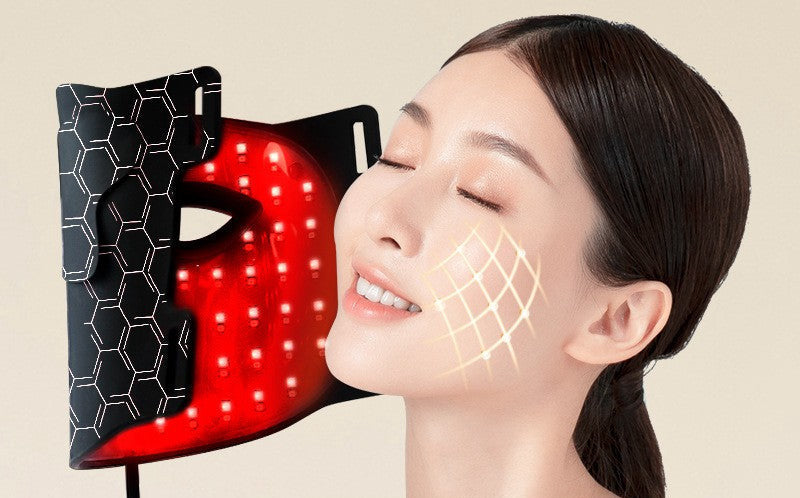 Amporea LED face mask in black, lit in red light therapy mode