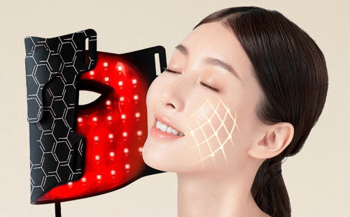 Amporea LED face mask in black, lit in red light therapy mode